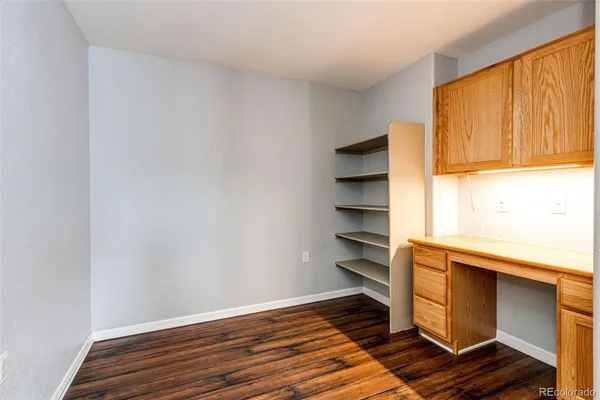 a view of walk in closet with empty racks