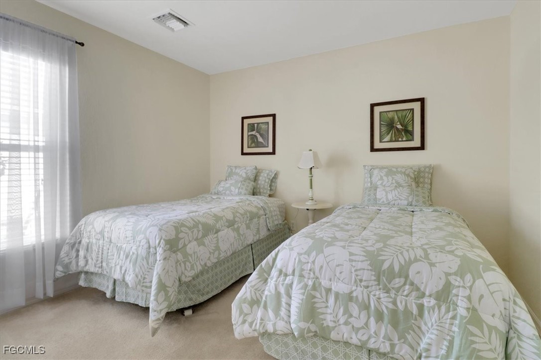 19674 Villa Rosa Loop Estero, FL 33967 - Photo 12 of 33 a bedroom with two beds and a window