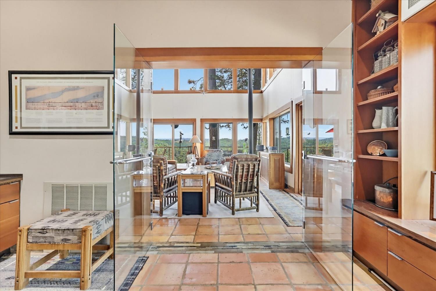 20111 Tanglewood Road Grass Valley, CA 95945 - Photo 27 of 93 a living room with lots of furniture and a floor to ceiling window