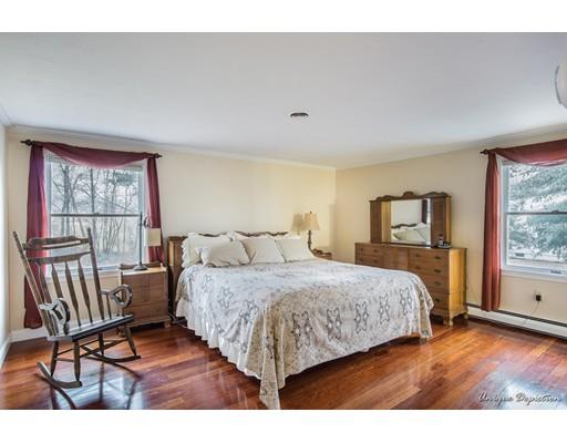 18 Argilla Road Methuen, MA 01844 - Photo 16 of 30 a bedroom with a bed a couch and a window with chair