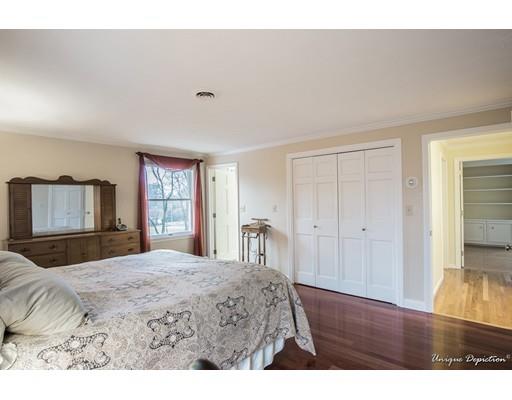 18 Argilla Road Methuen, MA 01844 - Photo 17 of 30 a bedroom with a bed and a dresser with wooden floor