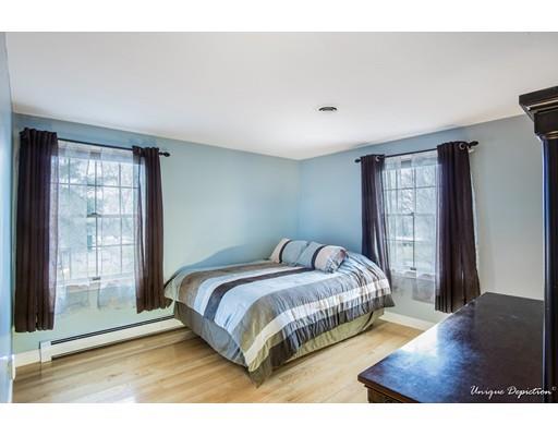 18 Argilla Road Methuen, MA 01844 - Photo 21 of 30 a bedroom with a bed lamp and window