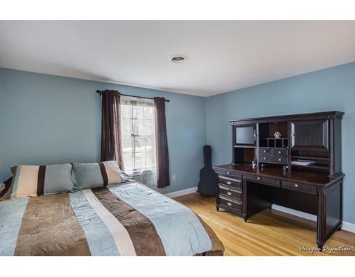 18 Argilla Road Methuen, MA 01844 - Photo 23 of 30 a bedroom with a bed and a desk