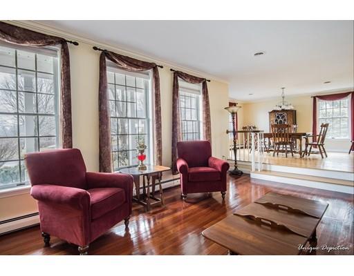 18 Argilla Road Methuen, MA 01844 - Photo 4 of 30 a living room with furniture and a floor to ceiling window