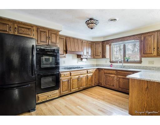 18 Argilla Road Methuen, MA 01844 - Photo 8 of 30 a kitchen with granite countertop a refrigerator and a sink