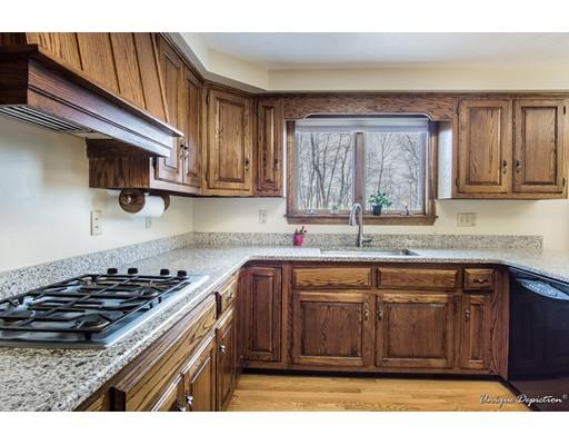 18 Argilla Road Methuen, MA 01844 - Photo 9 of 30 a kitchen with stainless steel appliances granite countertop a sink stove and cabinets