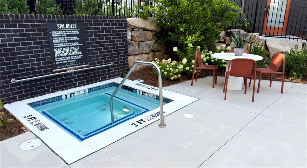 277 Clifton Street Southeast, Unit B1 Atlanta, GA 30317 - Photo 12 of 30 a view of a chairs and table in the backyard