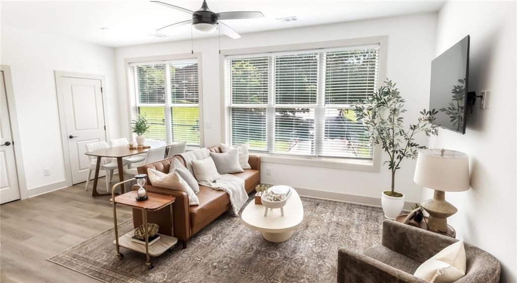 277 Clifton Street Southeast, Unit B1 Atlanta, GA 30317 - Photo 22 of 30 a living room with furniture and a flat screen tv