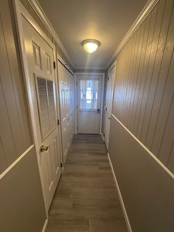 a view of gallery with wooden floor