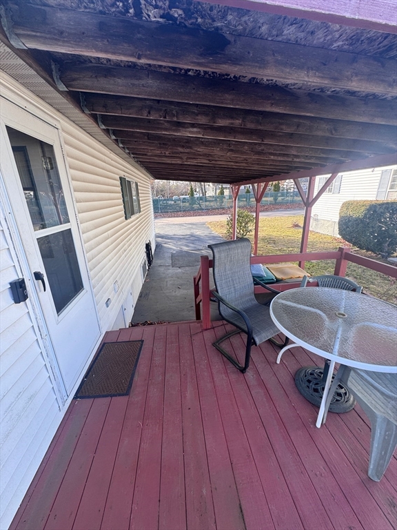 500 Mendon Road, Unit 257 Attleboro, MA 02703 - Photo 19 of 20 a outdoor space with wooden floor a barbeque oven and furniture