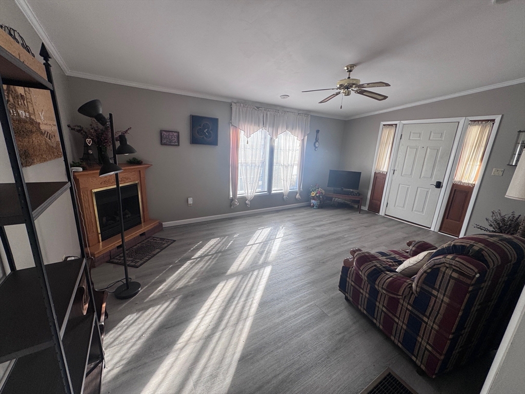 500 Mendon Road, Unit 257 Attleboro, MA 02703 - Photo 4 of 20 a living room with furniture and a flat screen tv