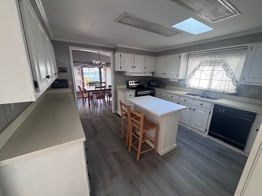 500 Mendon Road, Unit 257 Attleboro, MA 02703 - Photo 6 of 20 a kitchen with a stove a sink and a refrigerator