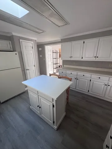 a kitchen with a stove and a refrigerator