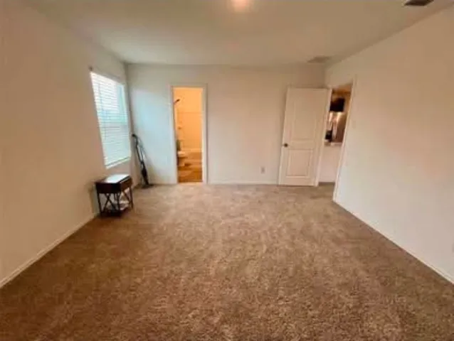 a bathroom with a double vanity sink toilet mirror and shower