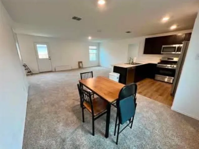 a view of a dining room with furniture