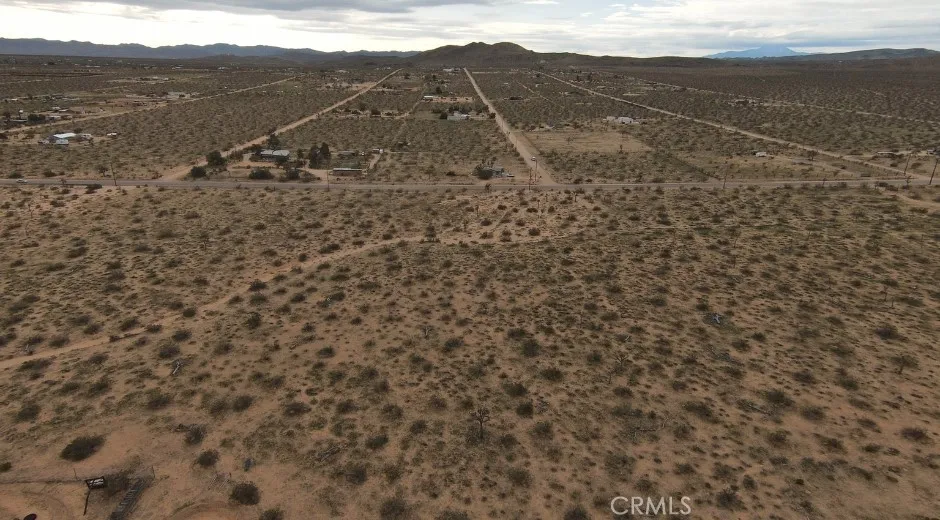59520 Reche Landers, CA 92285 - Photo 3 of 11 a view of a dry yard with mountains