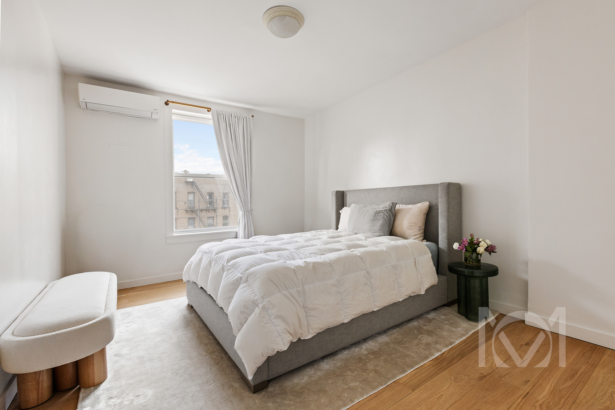 132 Remsen Street, Unit 12 Brooklyn, NY 11201 - Photo 3 of 8 a bedroom with a bed and chair