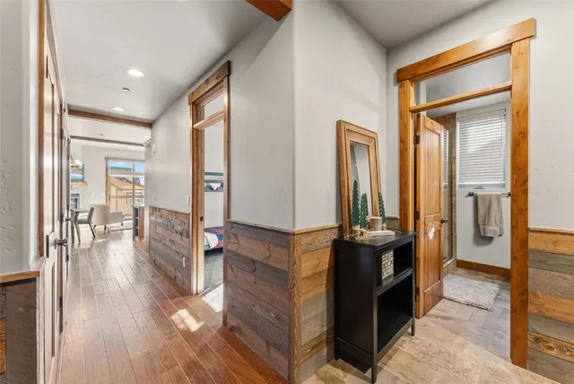 a hall way with furniture and wooden floor