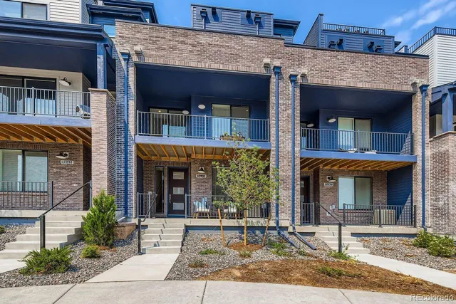 a view of a brick building with large windows