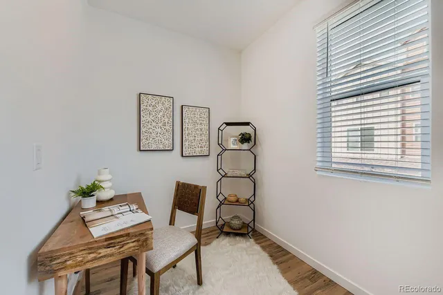 a work room with furniture and a window