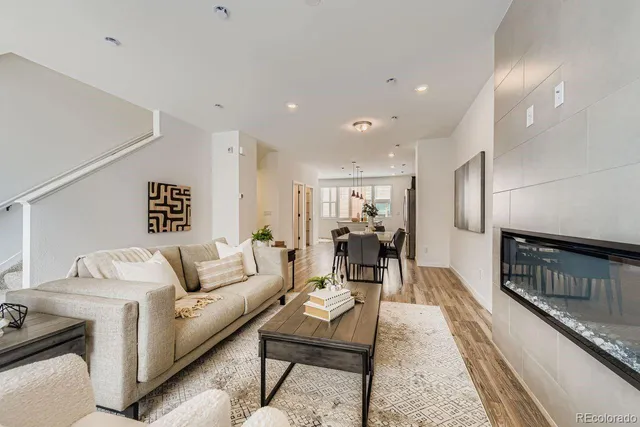 a living room with furniture and a table