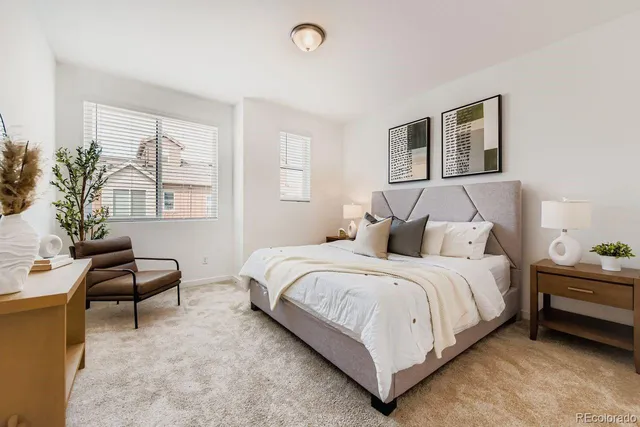 a bed room with a bed and a couch