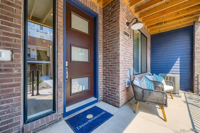 a view of an outdoor space with porch and wooden floor