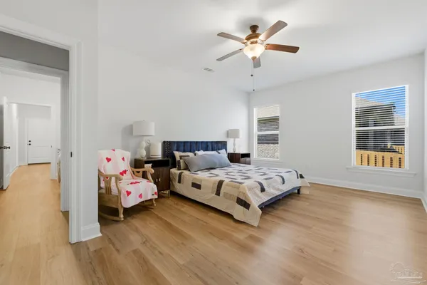a bed room with a bed and a window