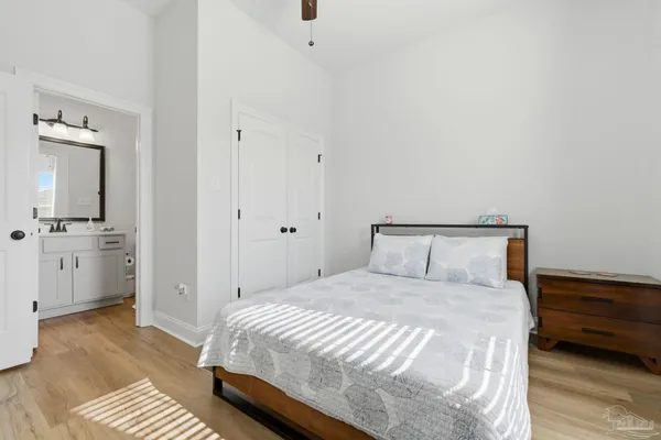 a bedroom with a bed and a view of bathroom