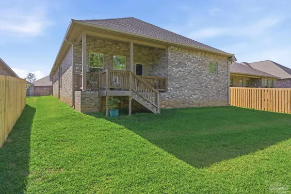 a view of a back yard of the house