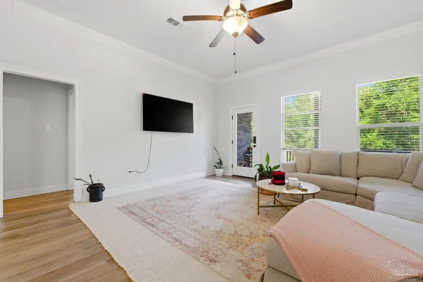 a living room with furniture and a flat screen tv