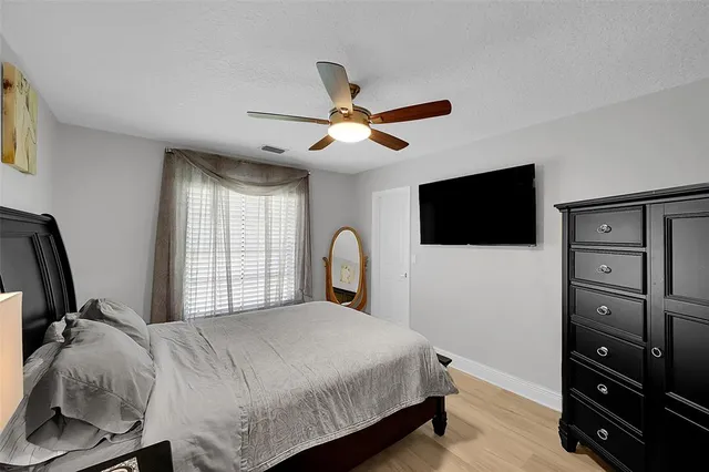 a view of a backyard with swimming pool