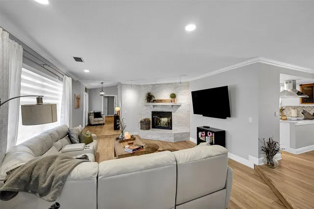 a living room with furniture and a fireplace