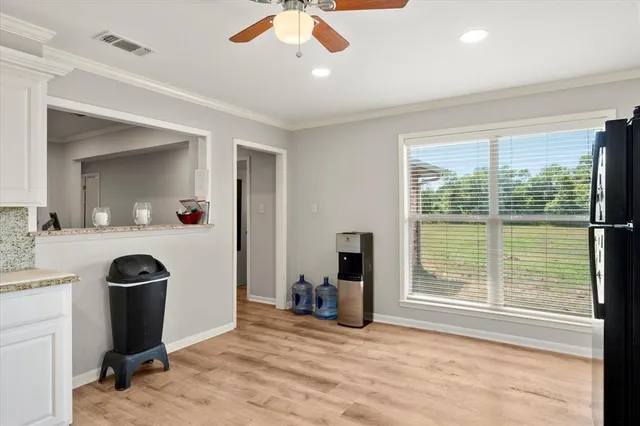 a view of a kitchen with a sink and a window
