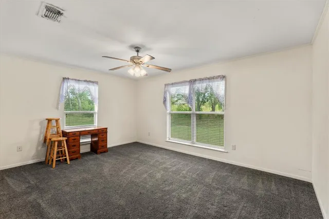 a view of workspace with furniture and window