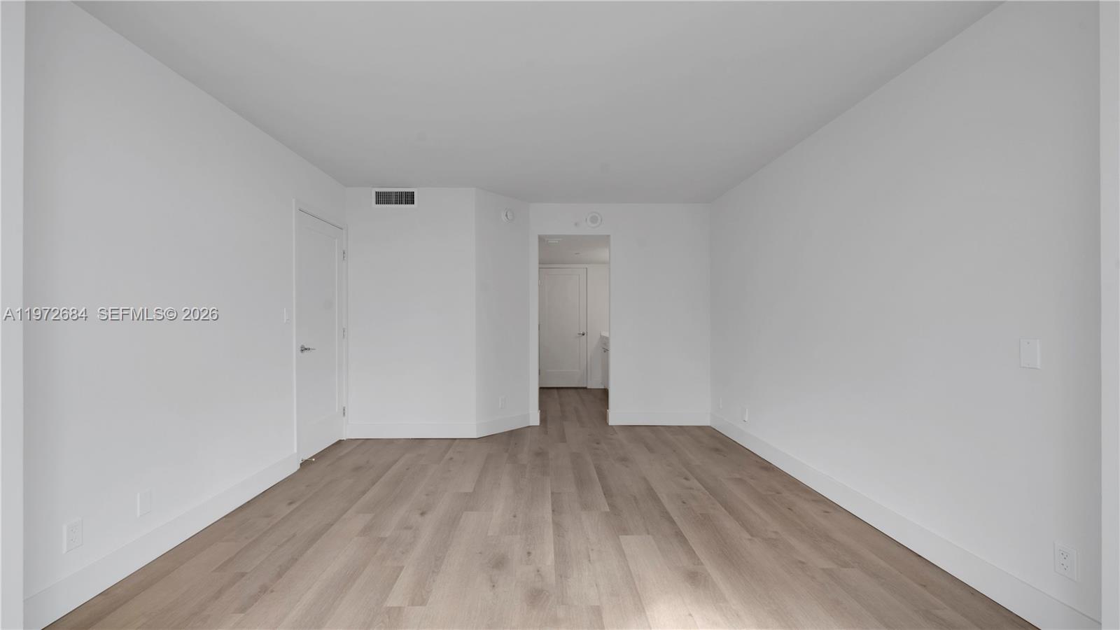 555 Northeast 34th Street, Unit 2607 Miami, FL 33137 - Photo 20 of 35 a view of a room with wooden floor