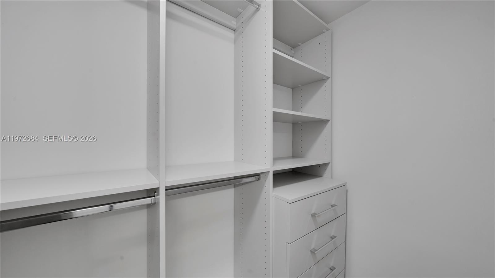555 Northeast 34th Street, Unit 2607 Miami, FL 33137 - Photo 25 of 35 a view of walk in closet with empty racks