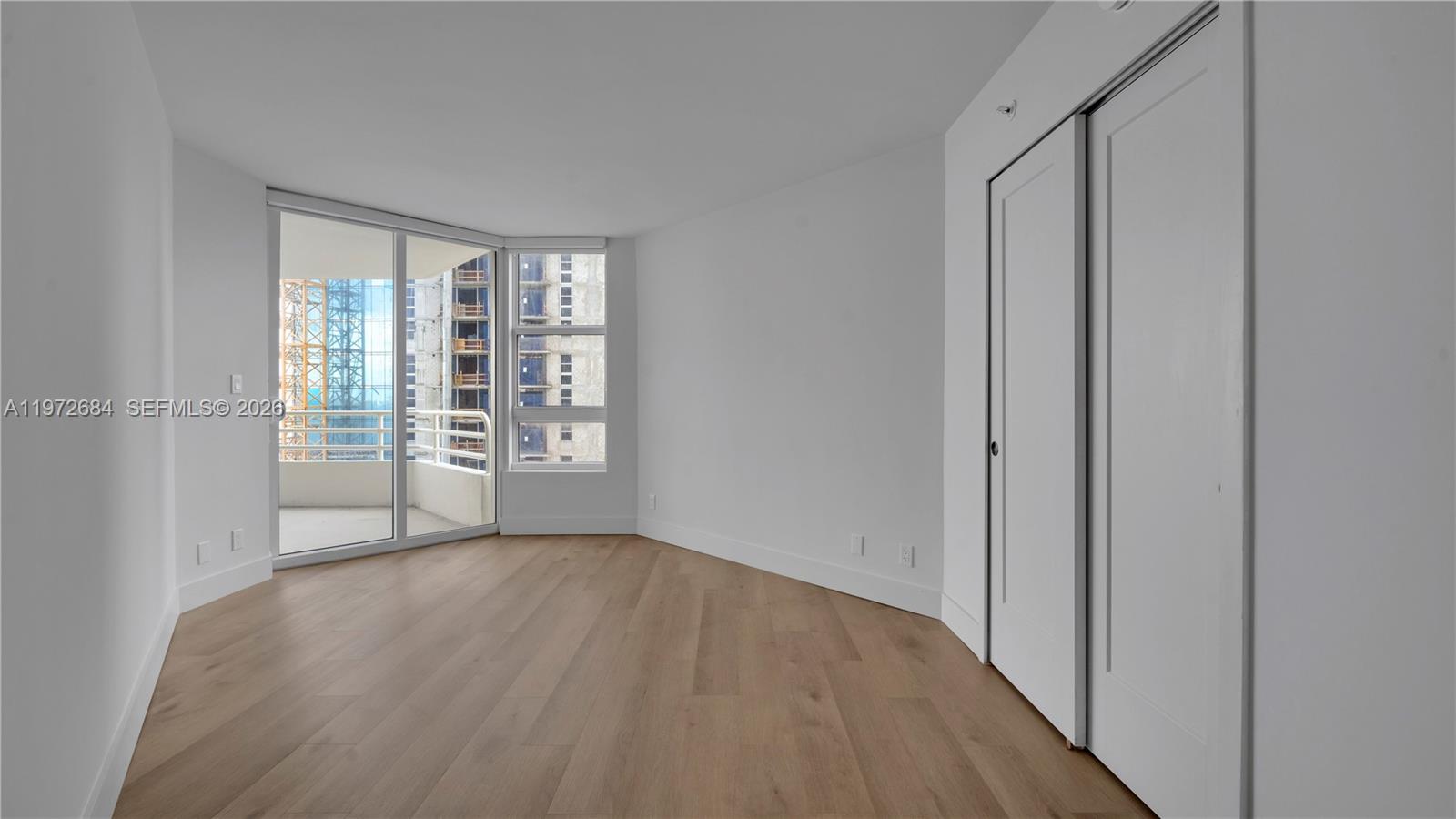 555 Northeast 34th Street, Unit 2607 Miami, FL 33137 - Photo 27 of 35 a view of an empty room with a window