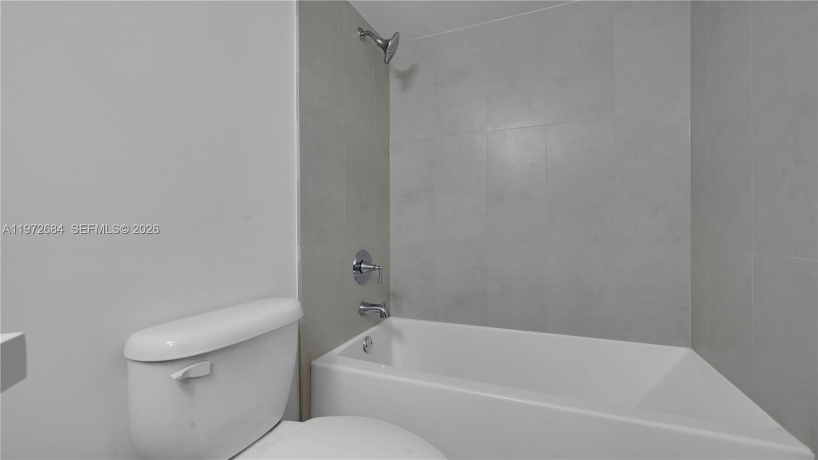 555 Northeast 34th Street, Unit 2607 Miami, FL 33137 - Photo 33 of 35 a white bath tub sitting next to a white toilet