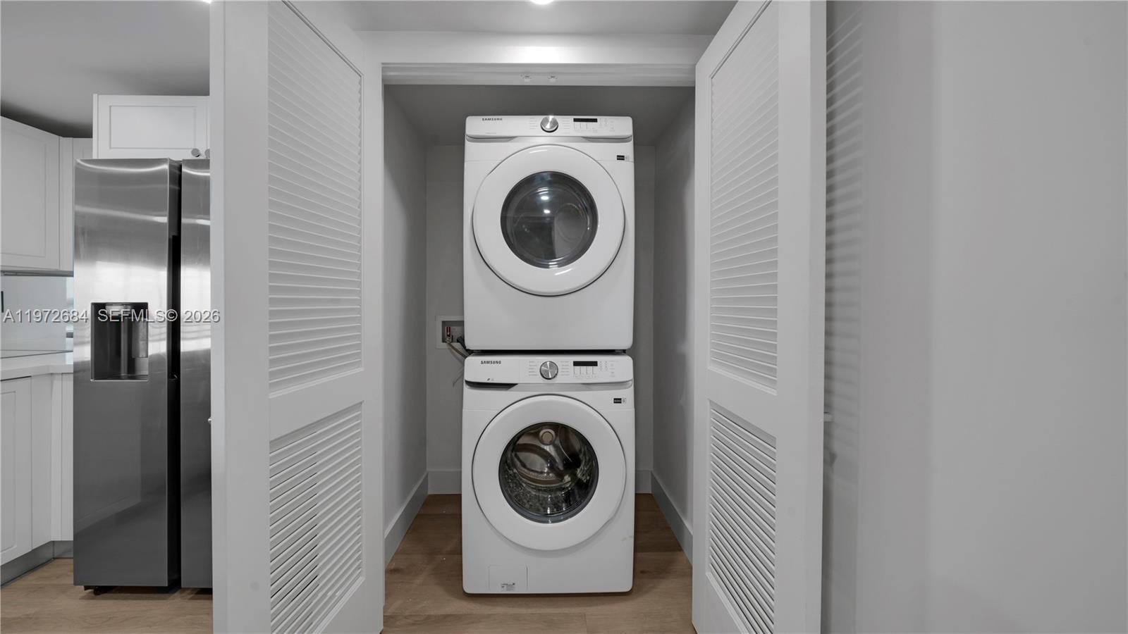 555 Northeast 34th Street, Unit 2607 Miami, FL 33137 - Photo 10 of 35 a utility room with dryer and washer