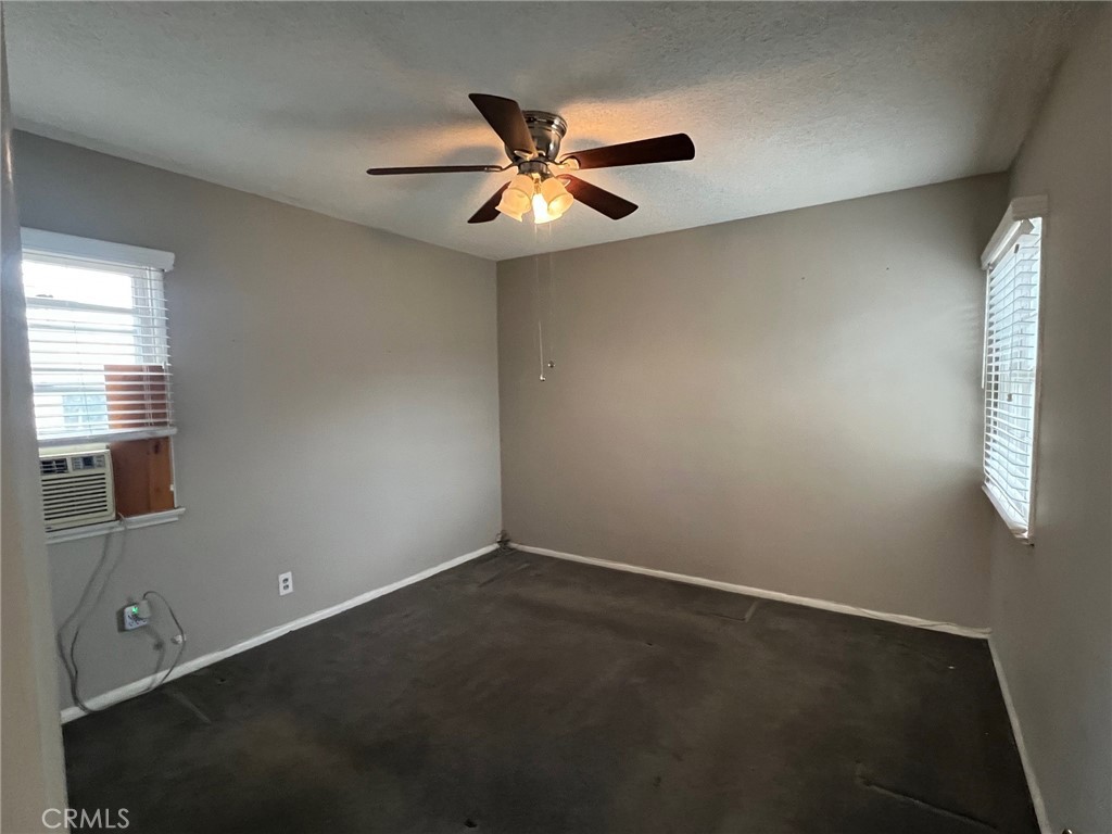 223 Albert Avenue Pomona, CA 91767 - Photo 12 of 18 an empty room with window and fan