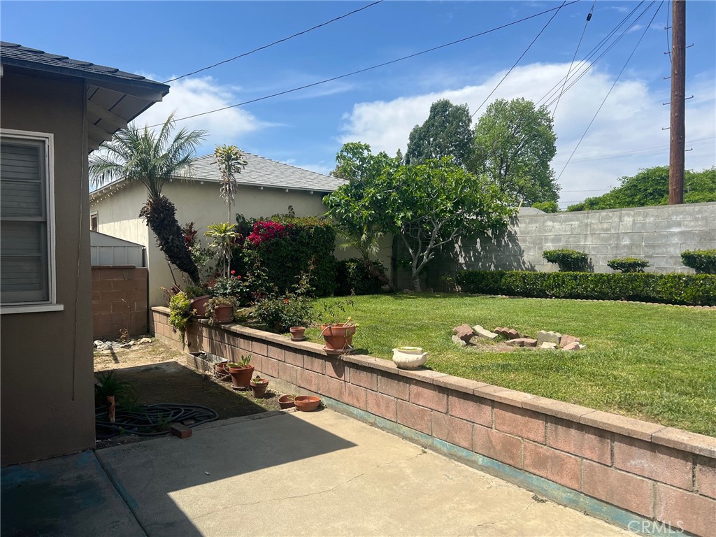 223 Albert Avenue Pomona, CA 91767 - Photo 15 of 18 a view of a house with a yard