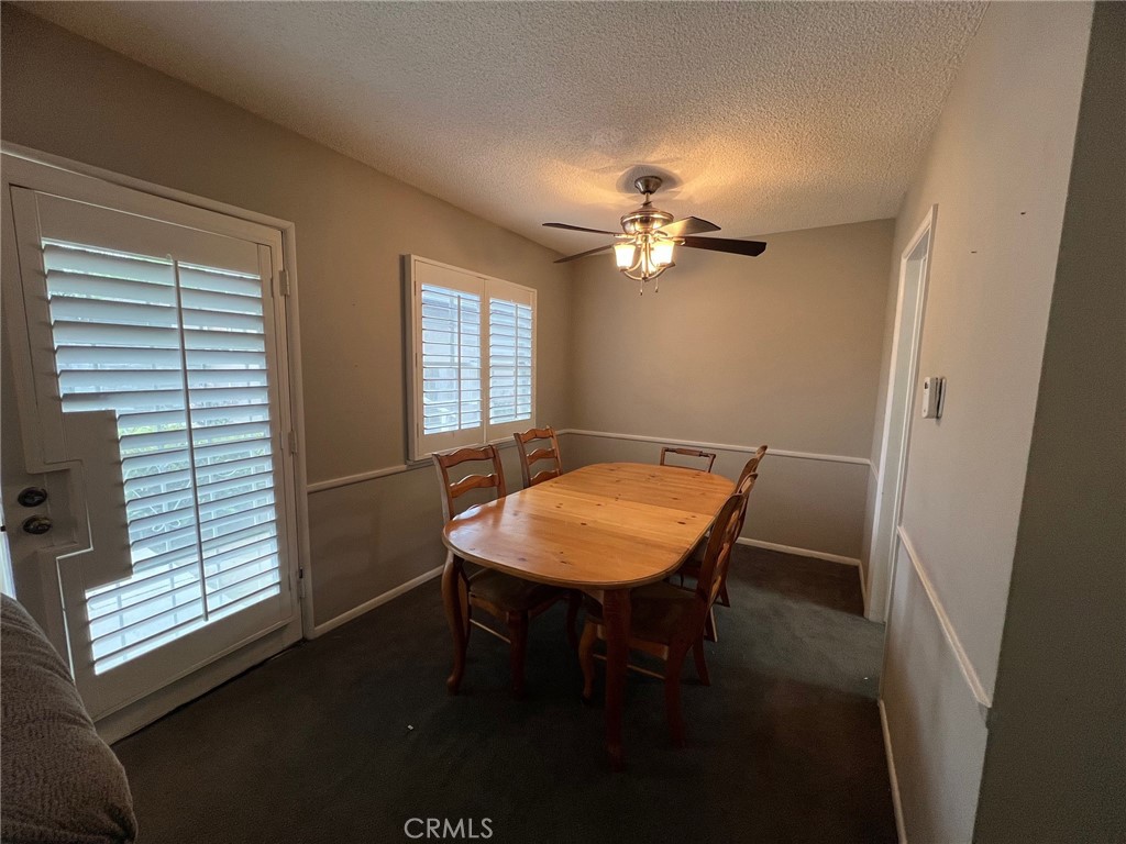 223 Albert Avenue Pomona, CA 91767 - Photo 10 of 18 a view of a dining room with furniture window and wooden floor