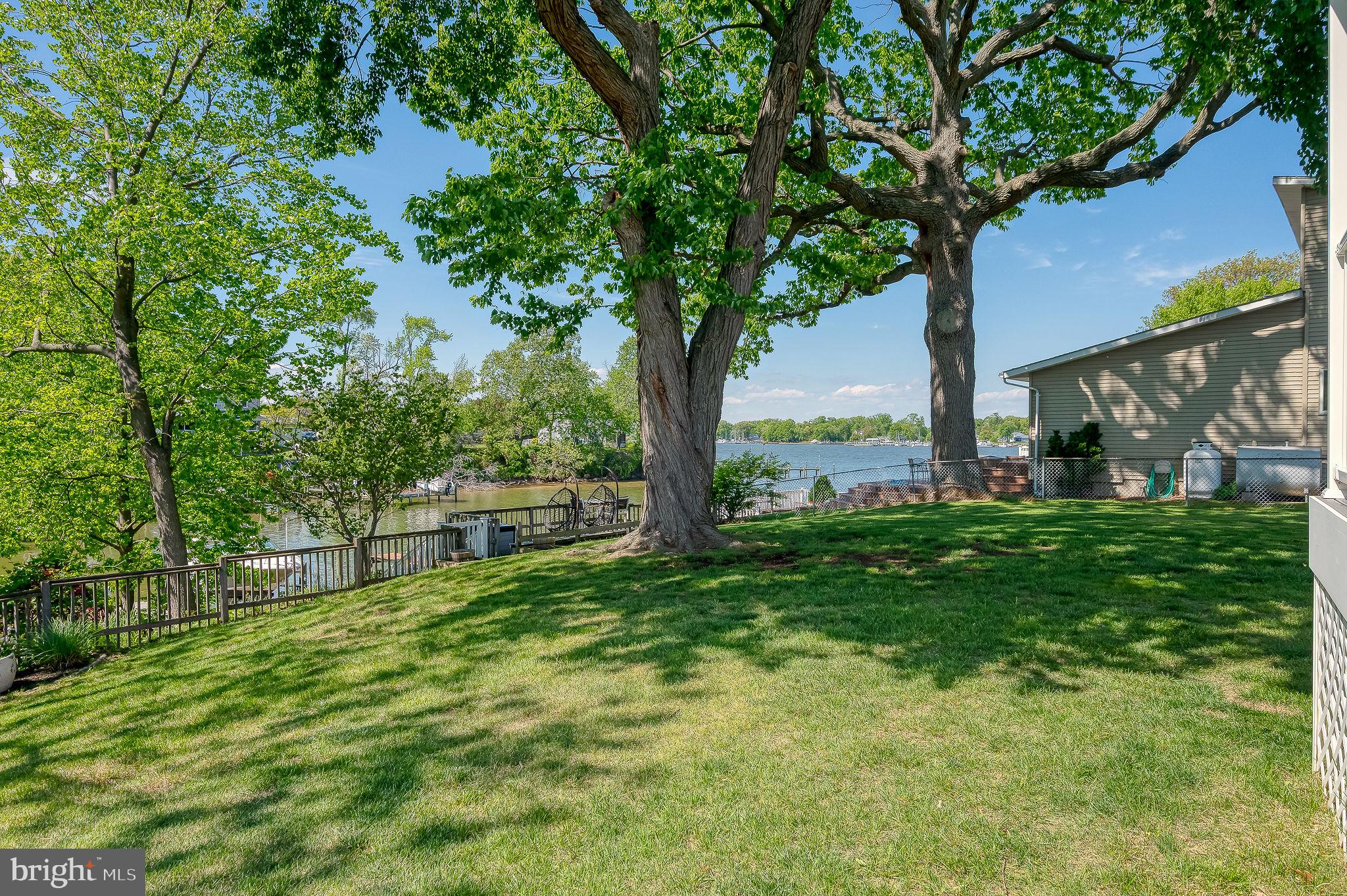 2222 Monocacy Road Essex, MD 21221 - Photo 46 of 70 Lush lawn by serene waterside.