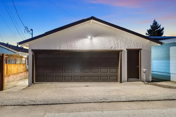 a front view of a house with a garage