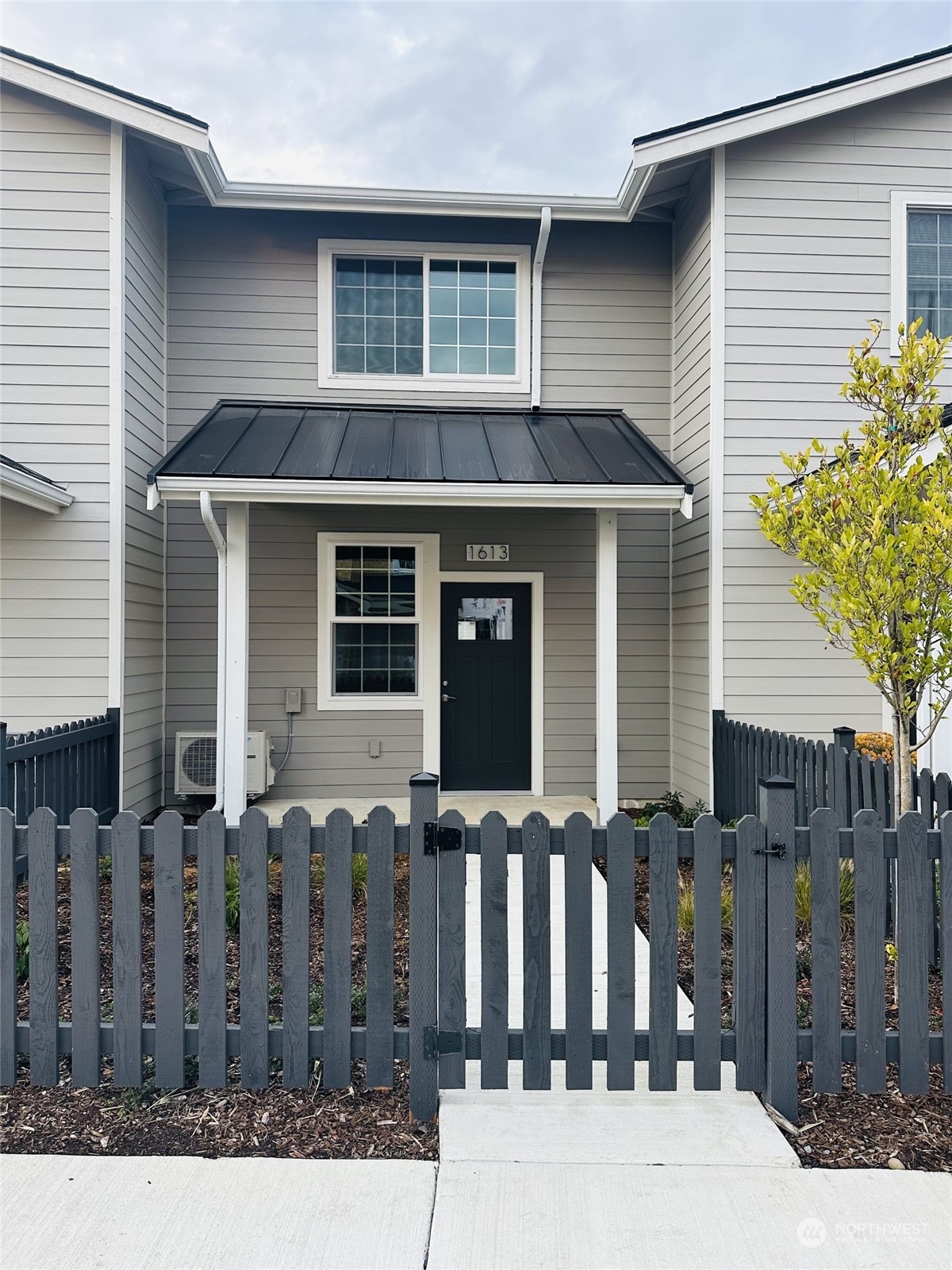 1613 Sunup Loop Bellingham, WA 98226 - Photo 2 of 13 a front view of a house with glass windows