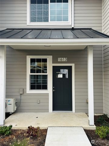 a front view of a house with a large window