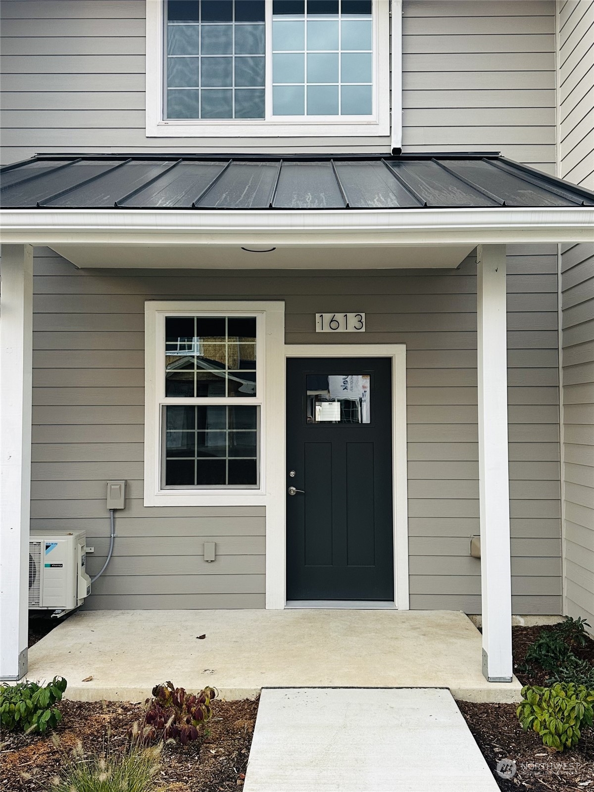 1613 Sunup Loop Bellingham, WA 98226 - Photo 3 of 13 a front view of a house with a large window