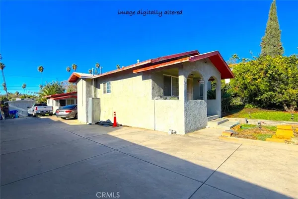 a view of the house with a patio