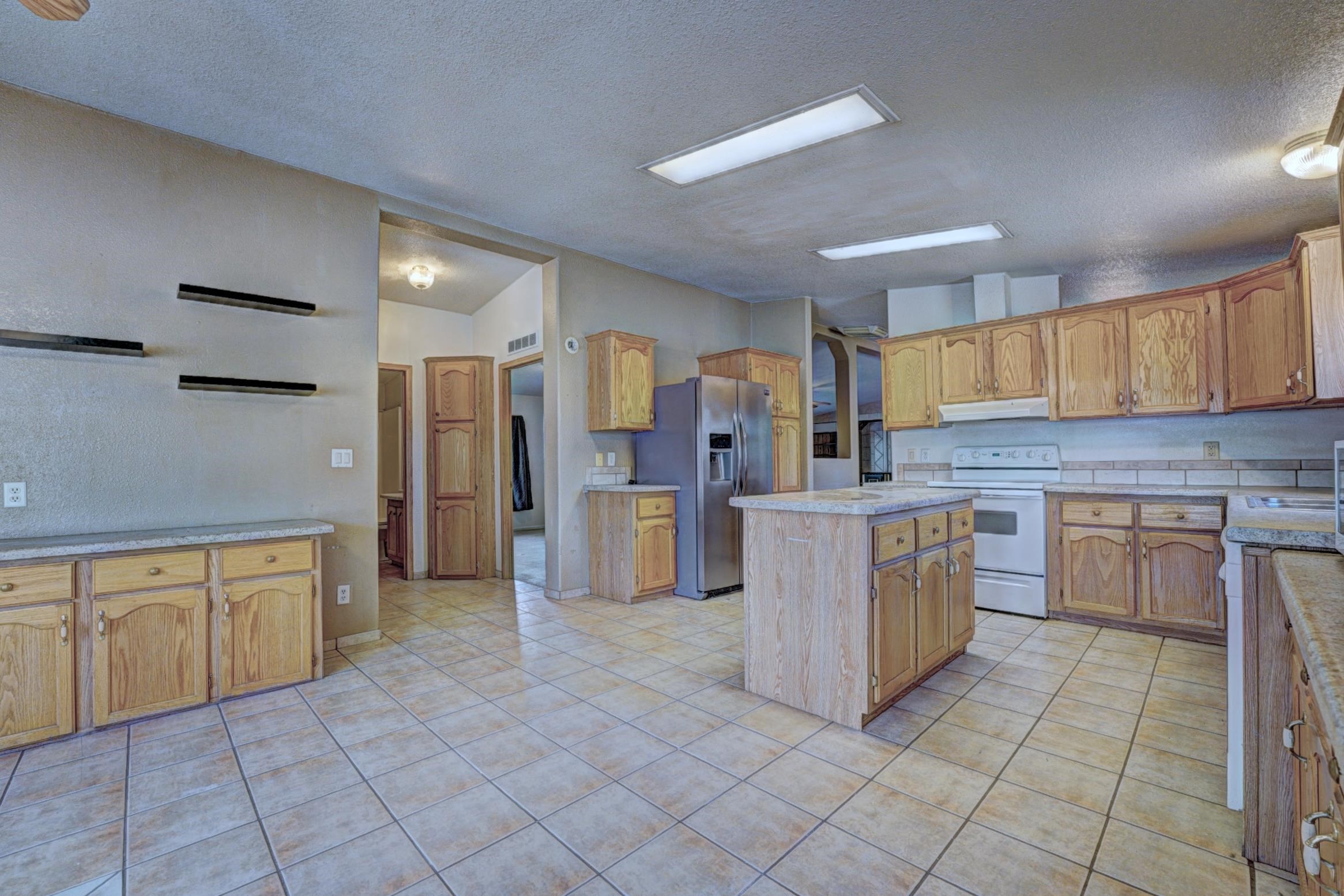 694-29 29 1/2 Road Grand Junction, CO 81504 - Photo 11 of 27 a kitchen with cabinets and refrigerator